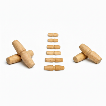 Wooden toggles and barrel toggles arranged on white background
