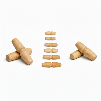 Wooden toggles and barrel toggles arranged on white background