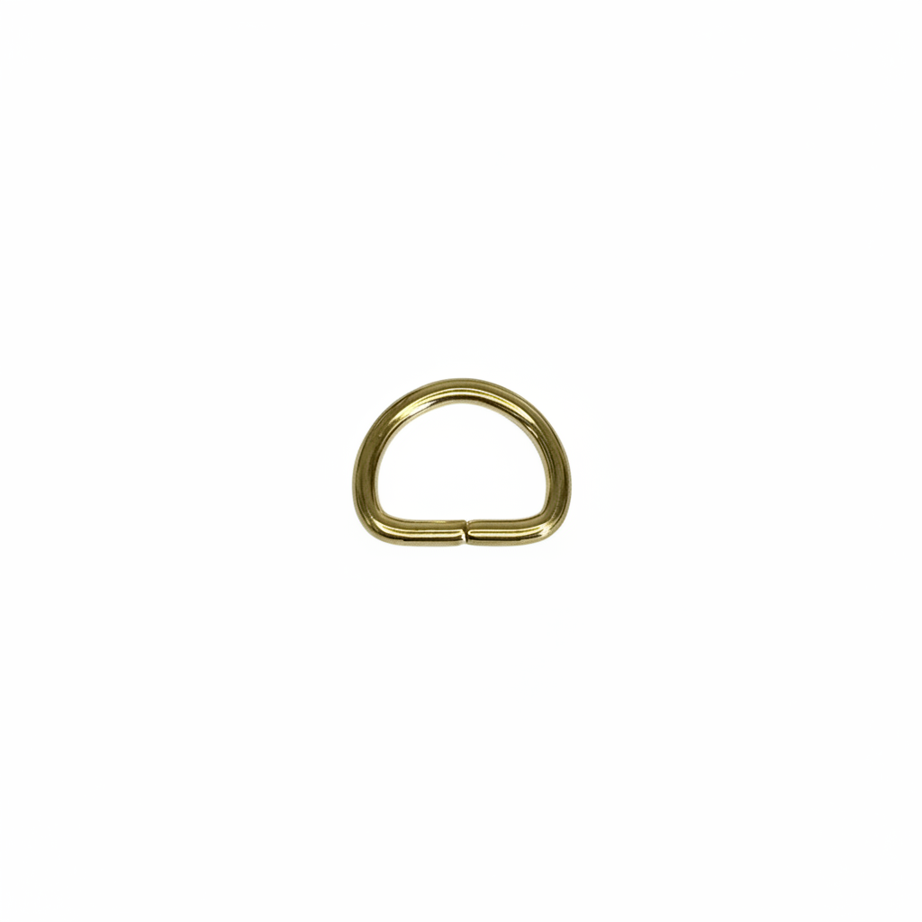 Small brass gold D-ring on brilliant white background