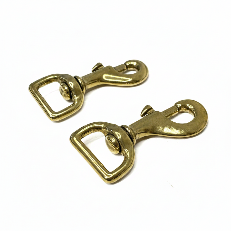Solid brass swivel snap hooks with square eye on brilliant white background