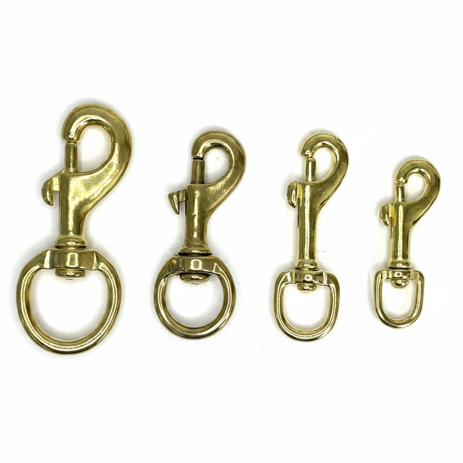 Brass swivel snap hooks four sizes brilliant white background