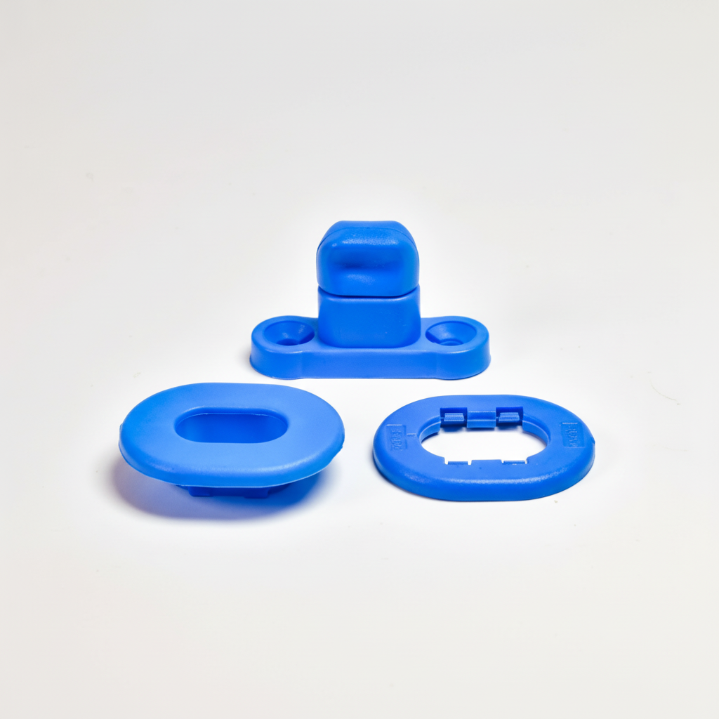 Blue plastic snap fastener components on white background